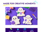 Halloween-themed ghost-shaped cookies with colorful icing on a purple craft backdrop, with paints and brushes nearby
