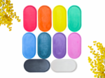 Bright popsicles in pink, orange, yellow, green, blue, and purple on a white background with yellow flowers at the edges.