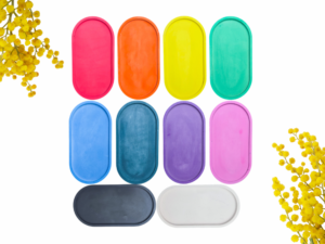 Bright popsicles in pink, orange, yellow, green, blue, and purple on a white background with yellow flowers at the edges.