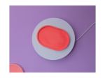 Abstract close-up of layered circular shapes in purple, gray, and coral on a purple background.