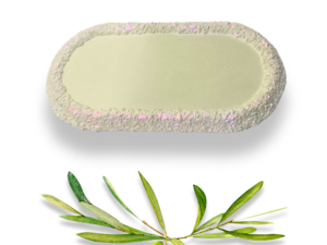 Handmade olive green elongated trinket tray with a smooth pale green centre and textured druzy-effect edge with subtle pink and iridescent shimmer.