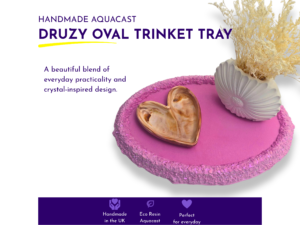 Pink druzy oval vanity tray styled with a gold heart-shaped dish and white shell vase holding dried flowers, alongside handmade product information.